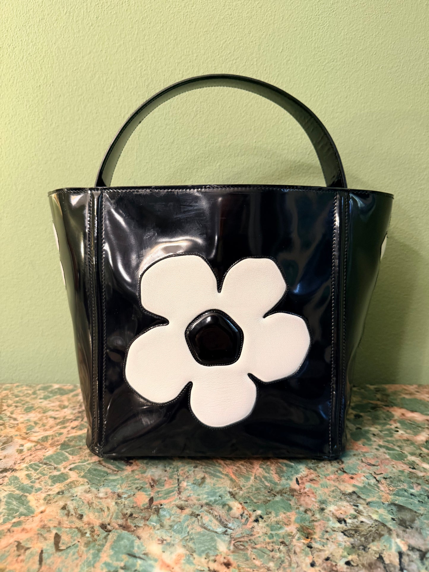 PRADA BLACK SPAZZOLATO FLOWER BUCKET HANDBAG