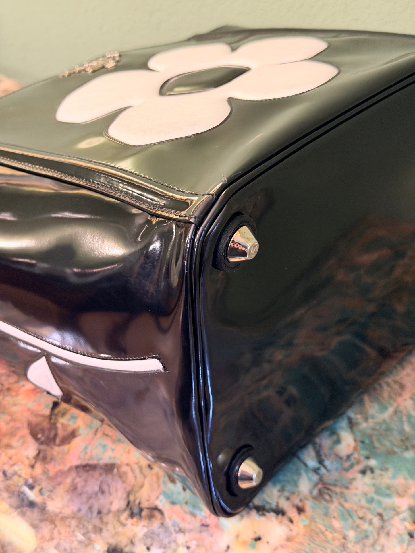 PRADA BLACK SPAZZOLATO FLOWER BUCKET HANDBAG