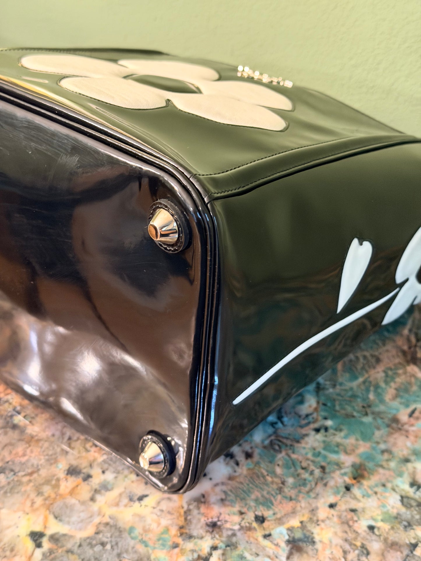 PRADA BLACK SPAZZOLATO FLOWER BUCKET HANDBAG