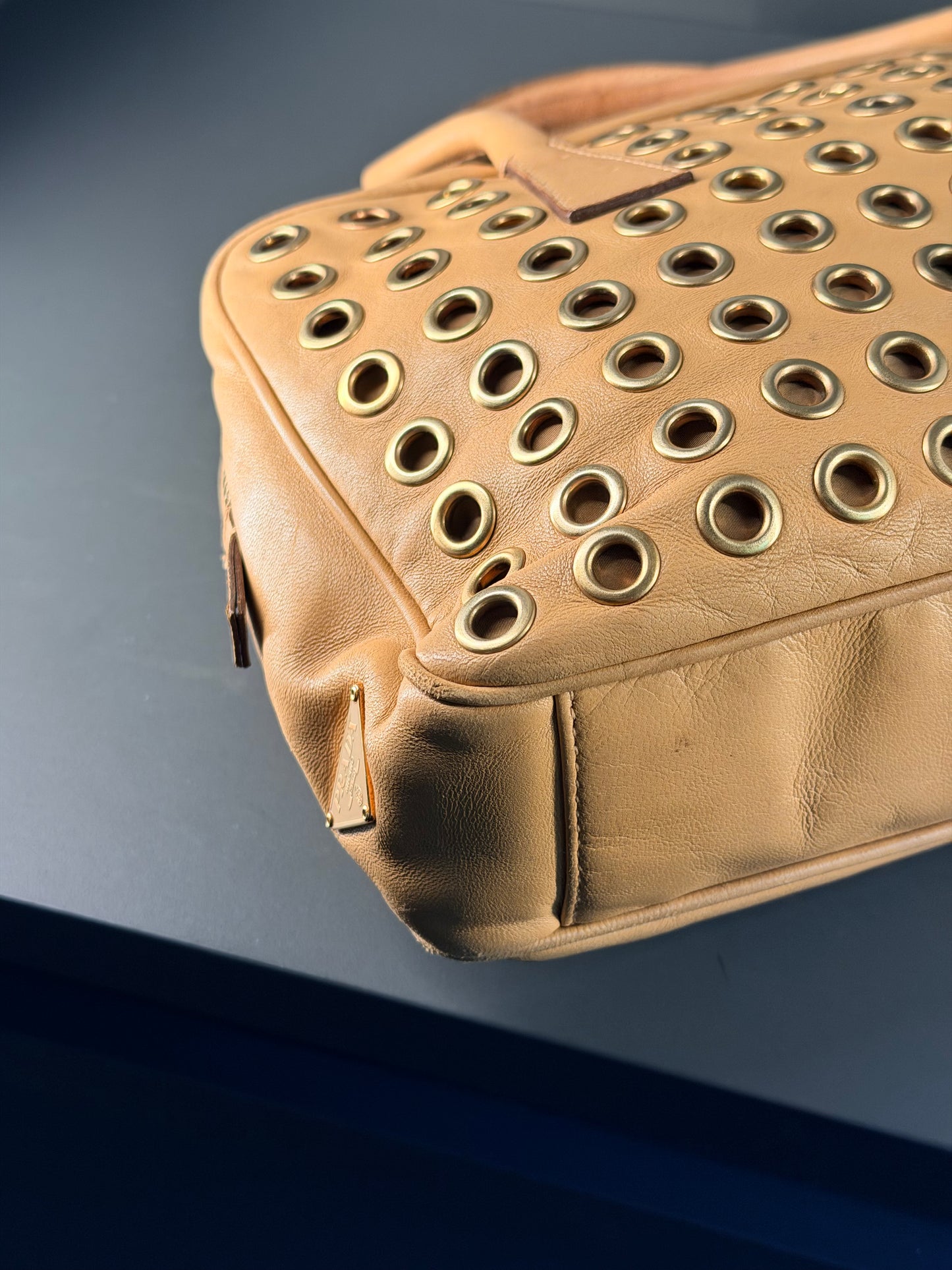 PRADA BEIGE GROMMET BAULETTO HANDBAG